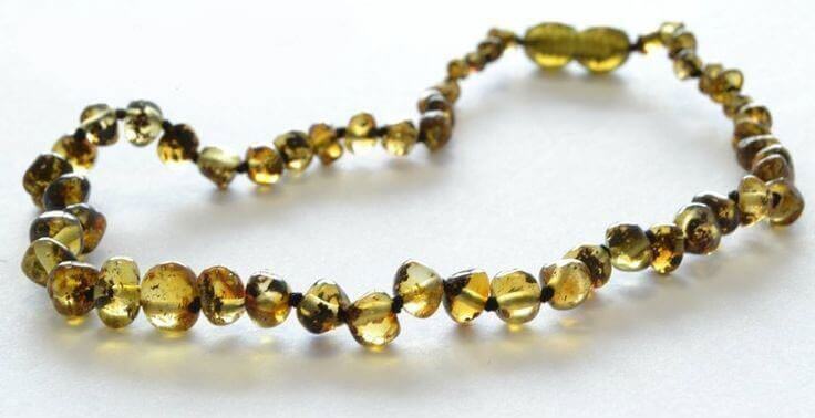 Collier Bébé en Ambre perles Rondes reflets verts