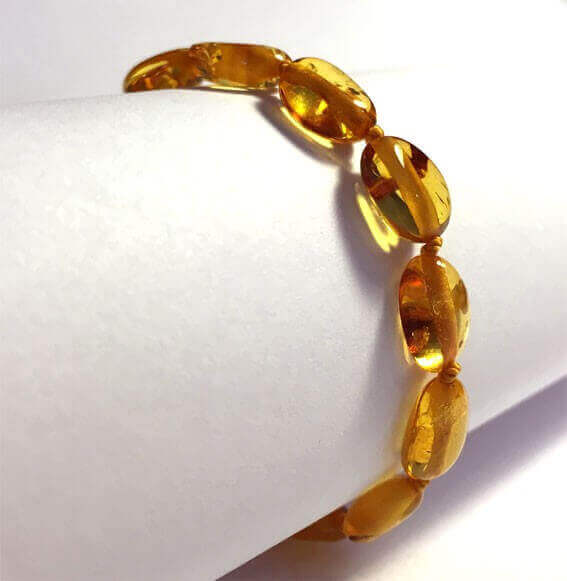 Bracelet bébé en Ambre avec fermoir olives Caramel